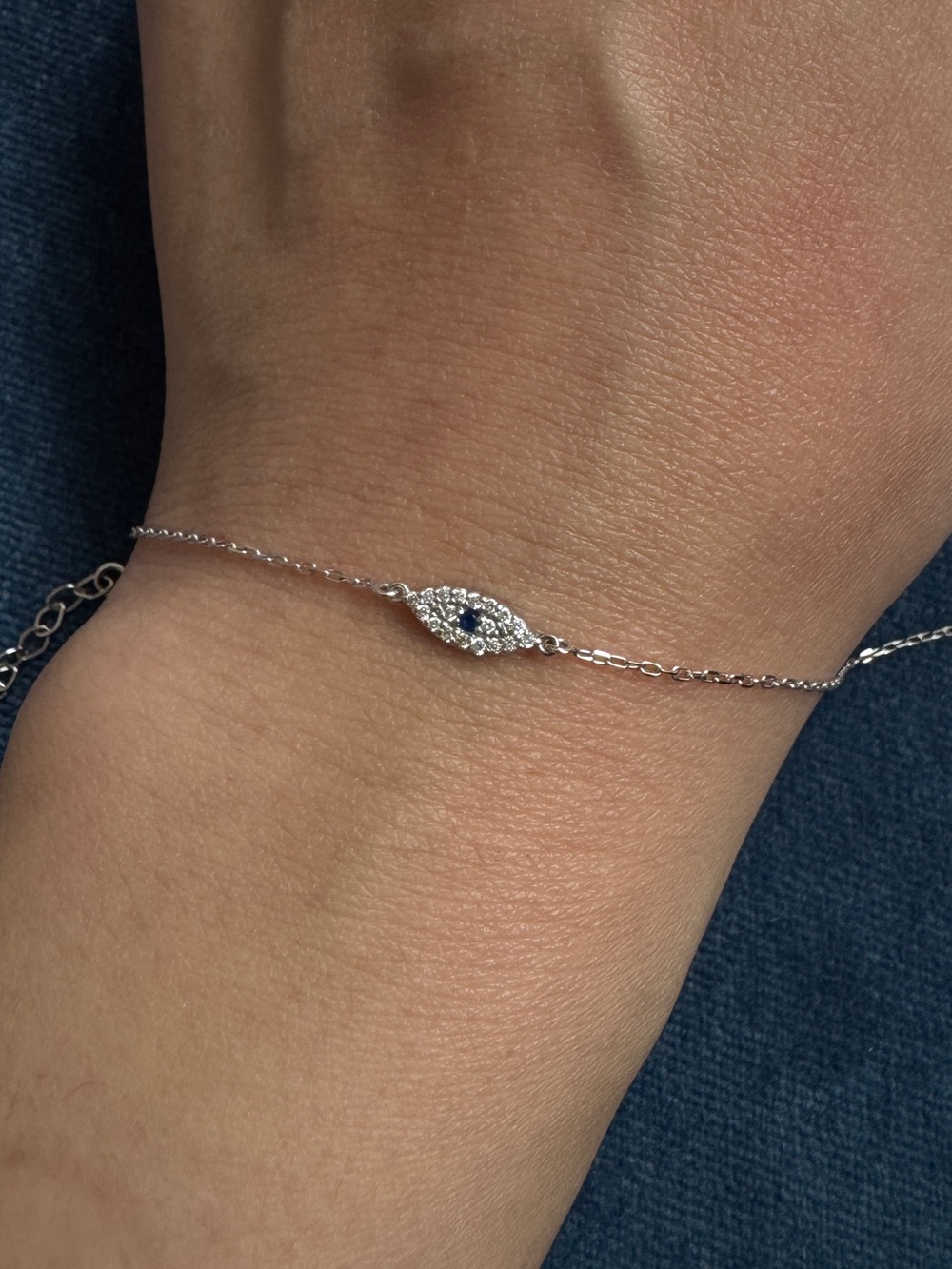 14k White Gold Diamond and Sapphire Evil
Eye Bracelet